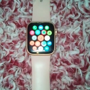 Apple Smartwatch with Gold Frame and Pink Strap